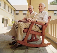 Elderly men in porch rocking chair 2
