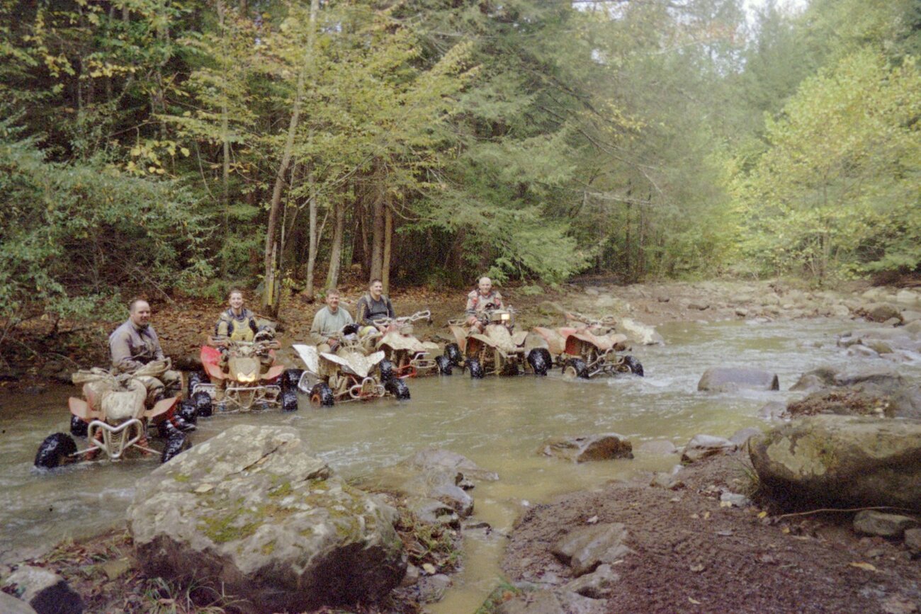 The group in the river at trail 10 and 13